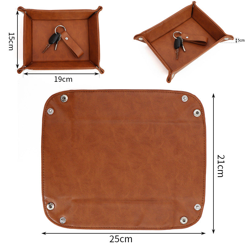 Brown foldable leather organizer tray shown flat (25x21cm) and folded (19x15cm) with metal rivets.